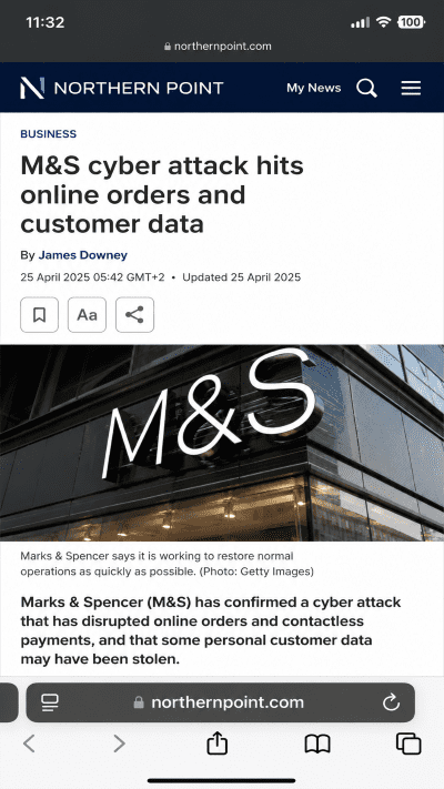 Exterior of a Marks & Spencer building with a large M&S logo on the glass façade; accompanies an article about a cyber attack on online orders and customer data.